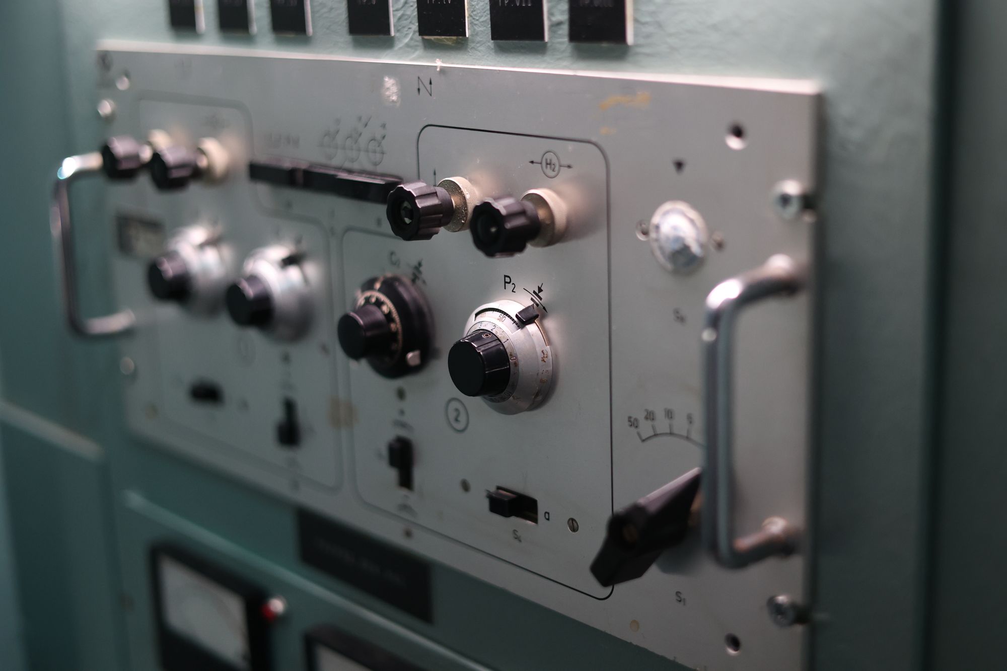 Industrial control room panel with instrumentation dials