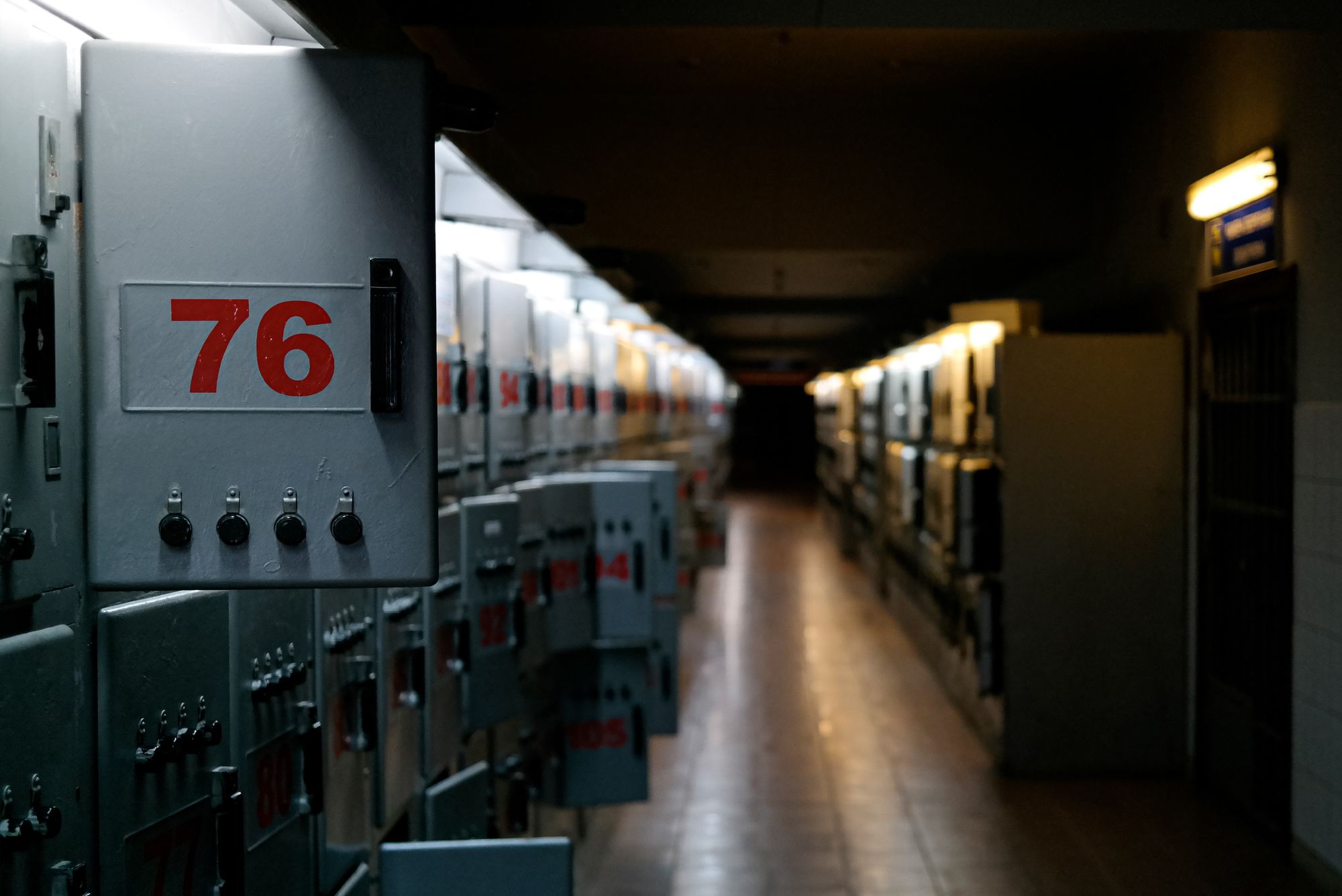 Electrical enclosures lining an industrial corridor