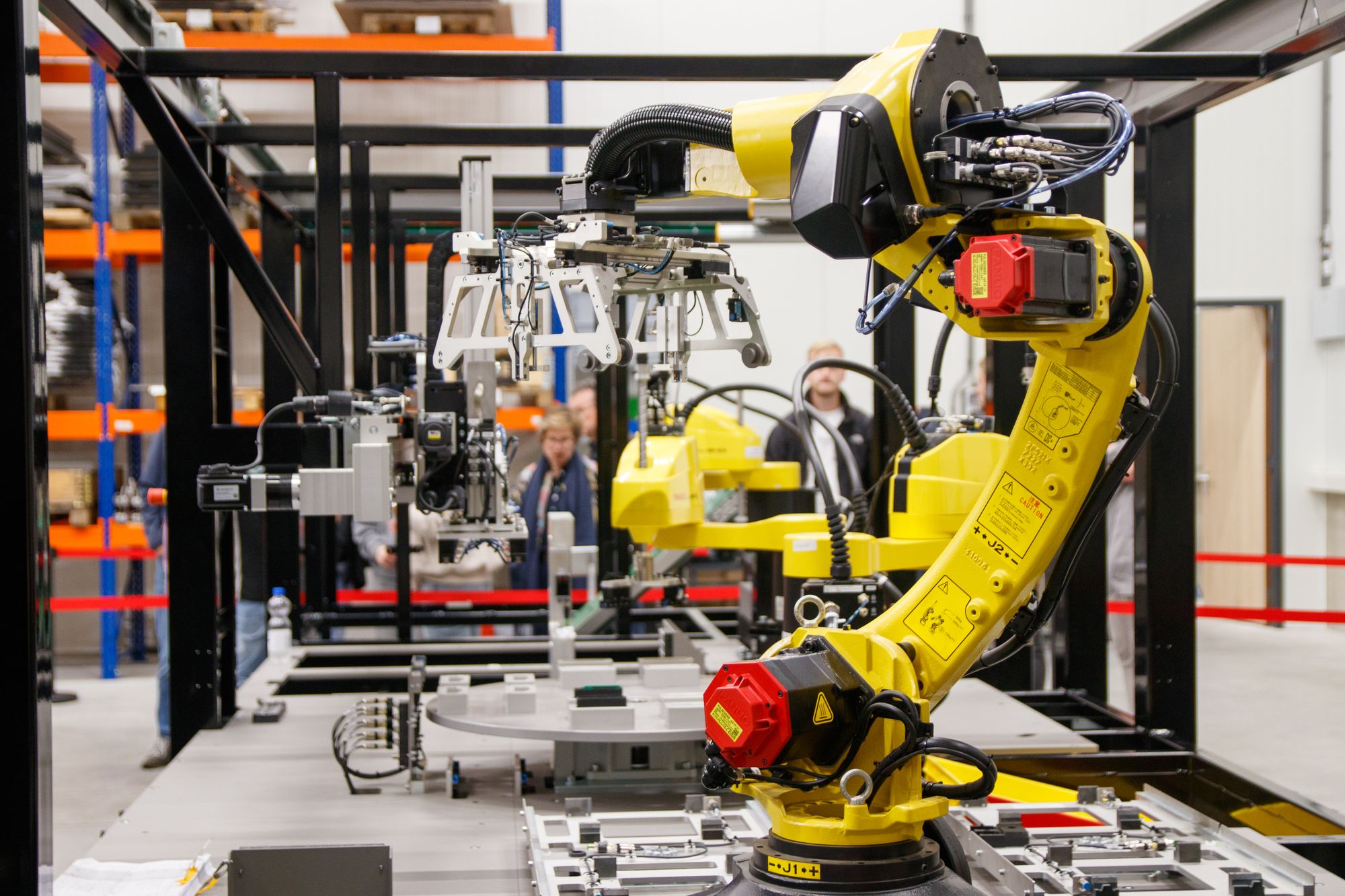 Robotic arms on an automated production line