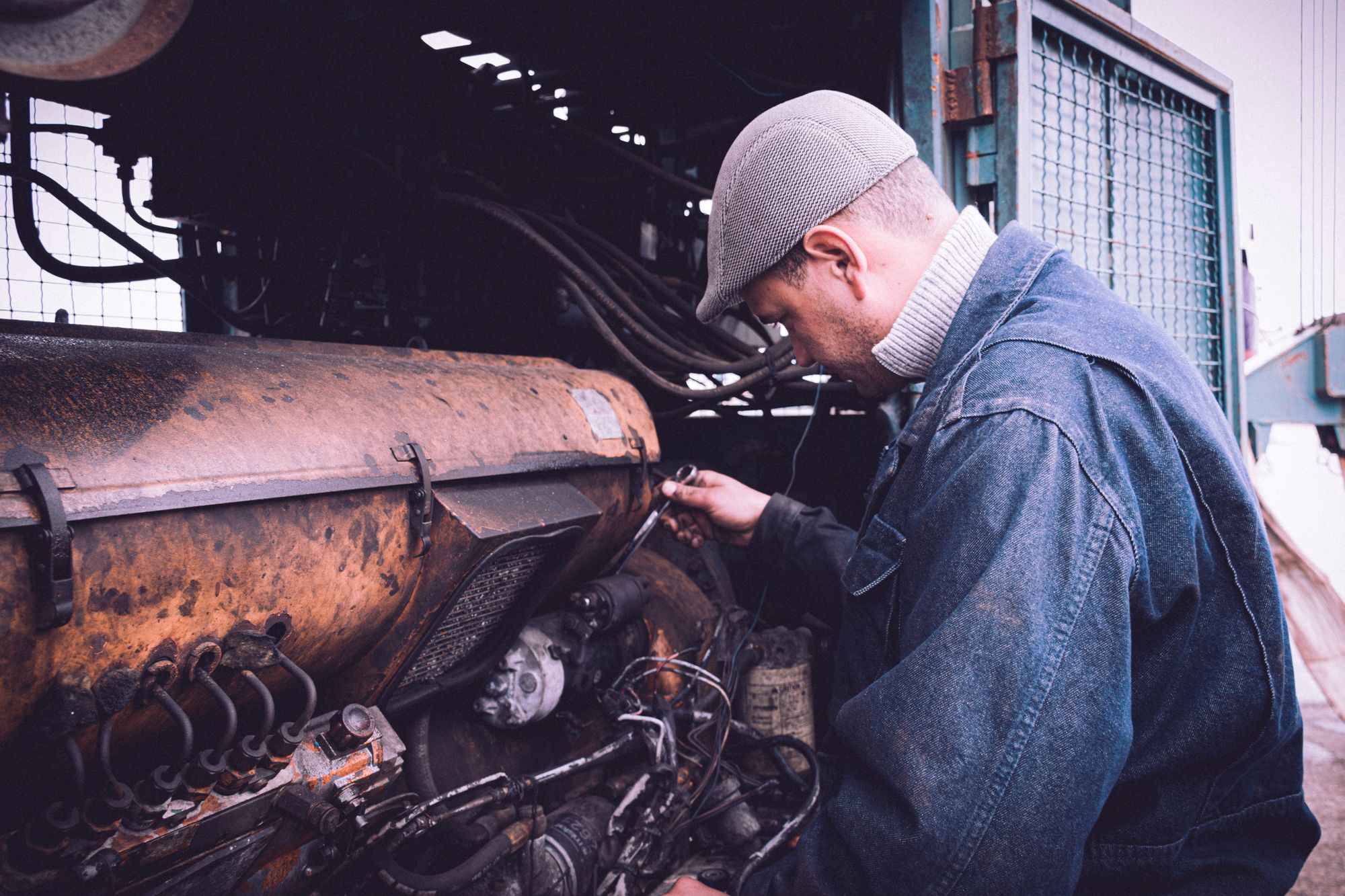 Engineer carrying out maintenance on a large engine
