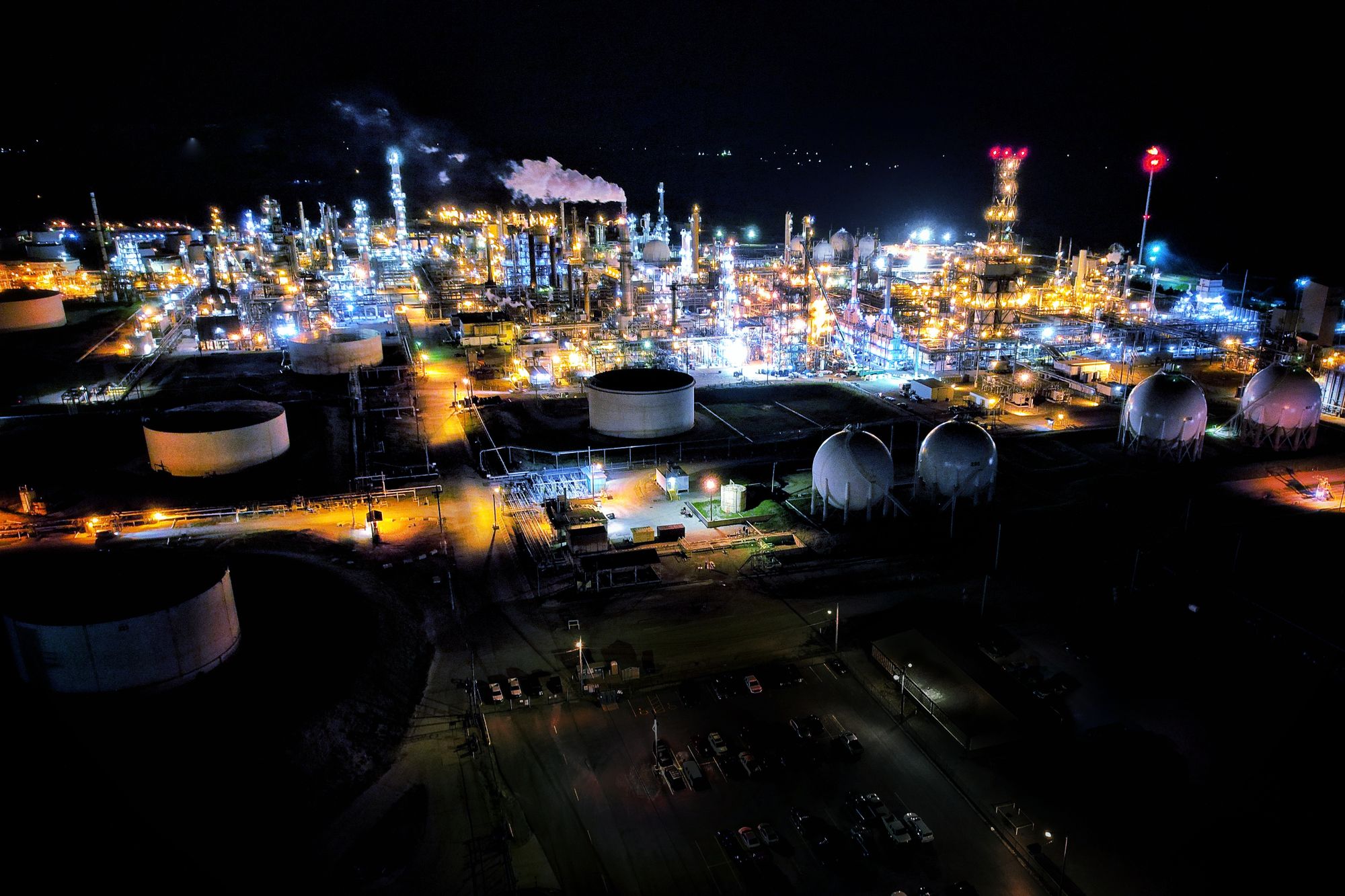 Petrochemical refinery illuminated at night
